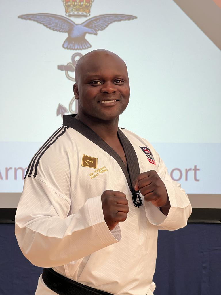 Yamie Guba smiling in Taekwondo uniform
